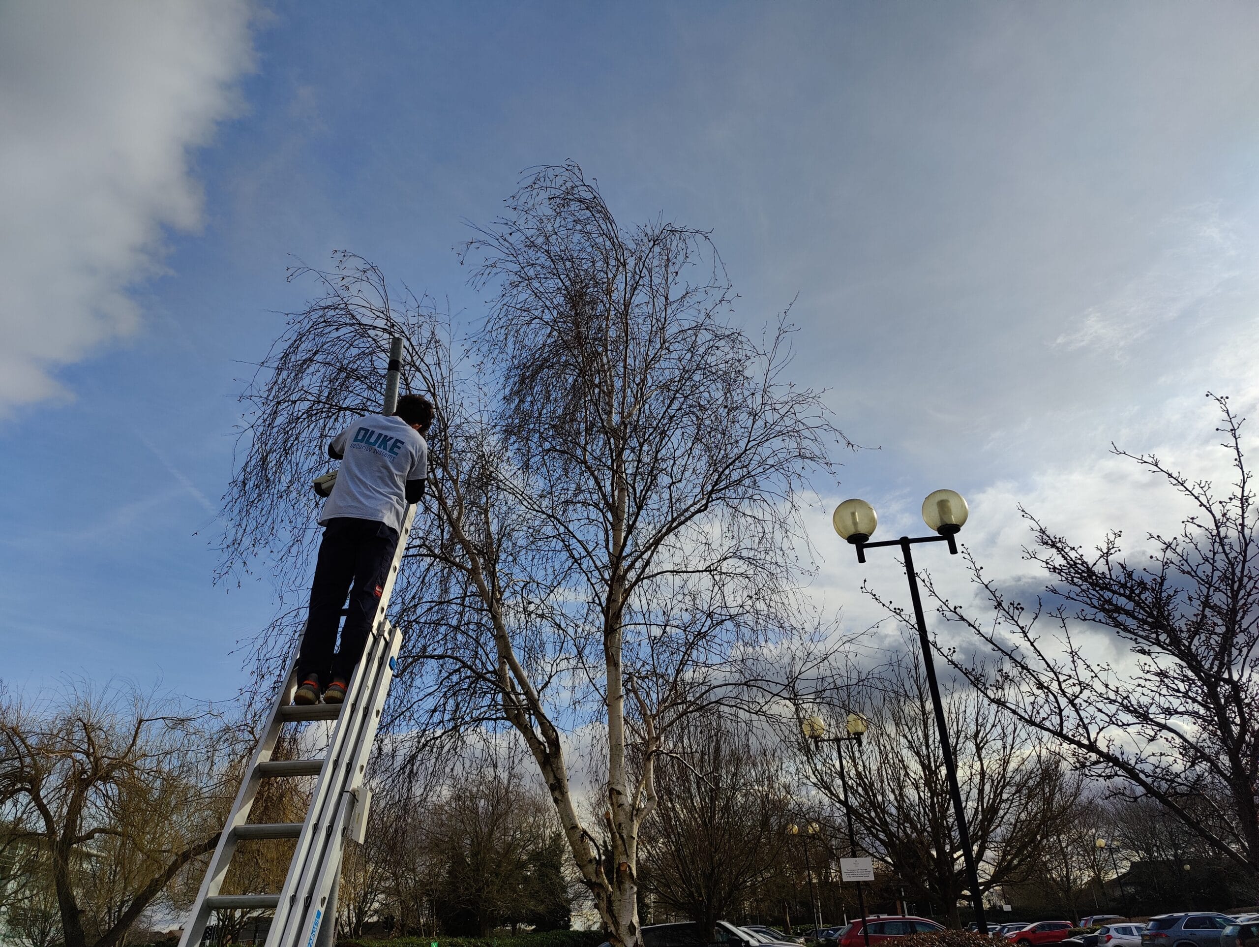 CCTV camera installation on lamppost by Duke Security Systems engineer in Peterborough